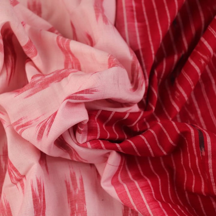 White and red cotton Sambalpuri Saree with motifs, elegantly draped.