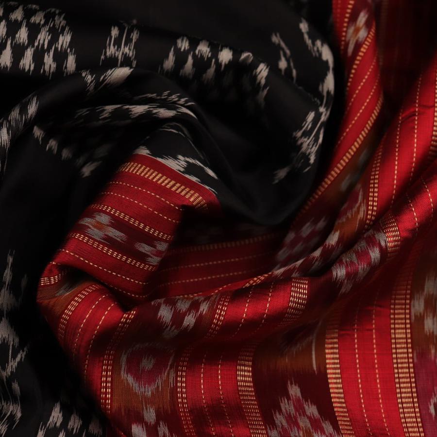 Full view of a black Khandua silk saree with red motifs.