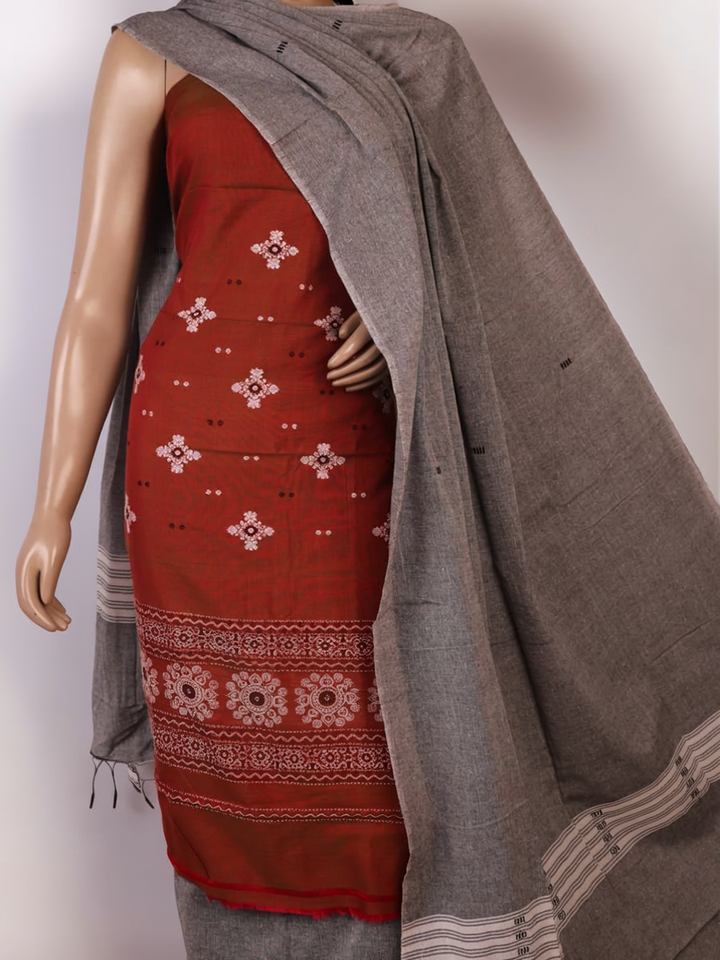 Coordinating Bomkai Cotton blouse piece detail, showcasing subtle multi-color patterns on a grey fabric.