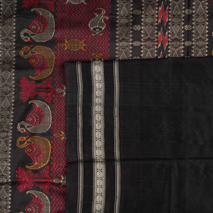 Extreme close-up revealing the fine handloom texture and intricate weave of the Bomkai silk fabric.