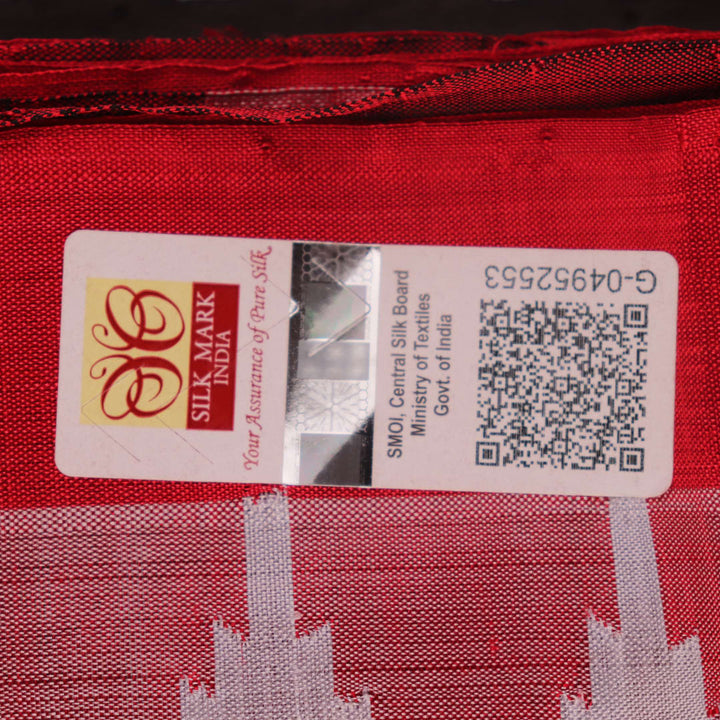 Close-up of grey and red Sambalpuri Silk saree fabric texture, highlighting butta pattern weave.