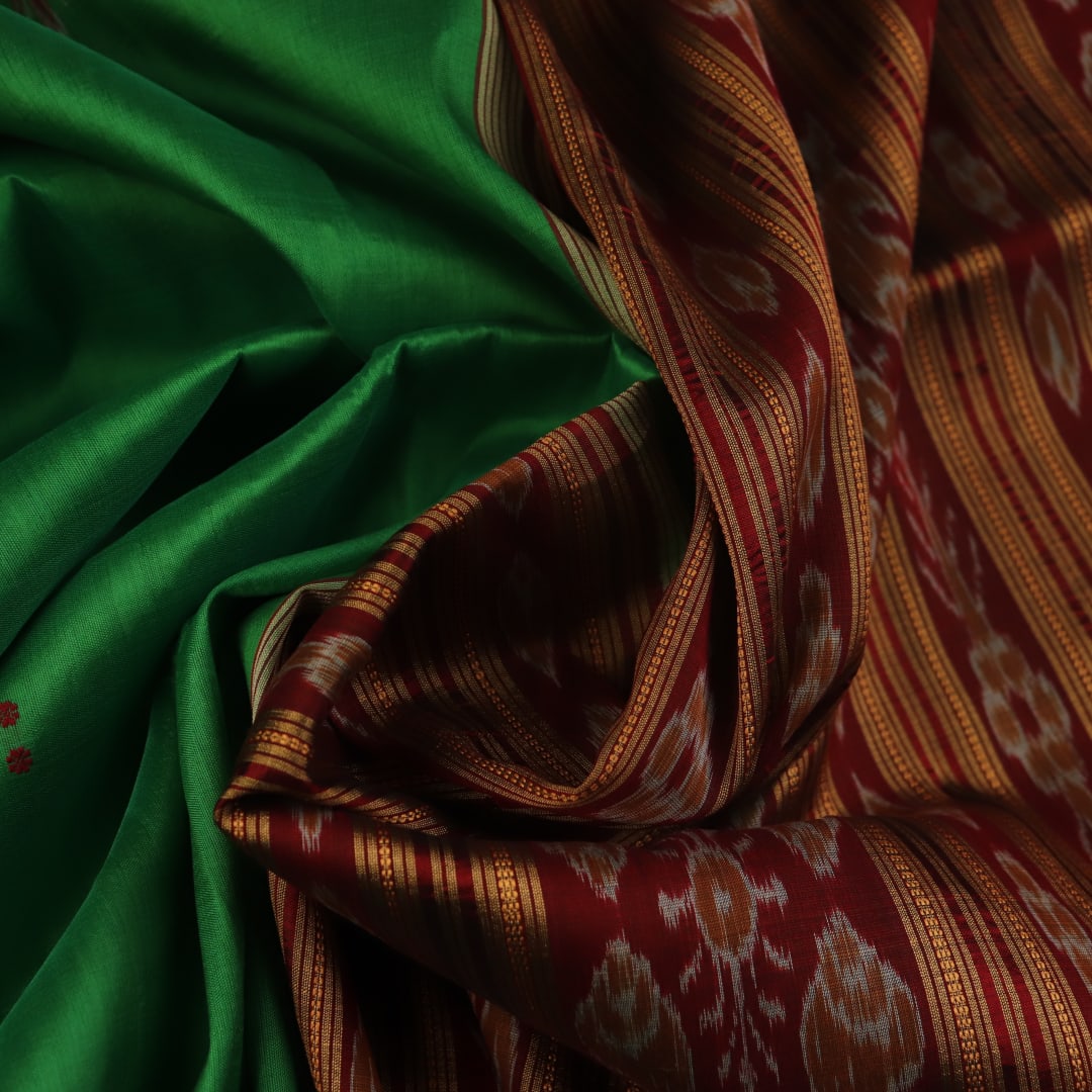 Green Khandua silk saree, styled or draped to show its overall look and fall.