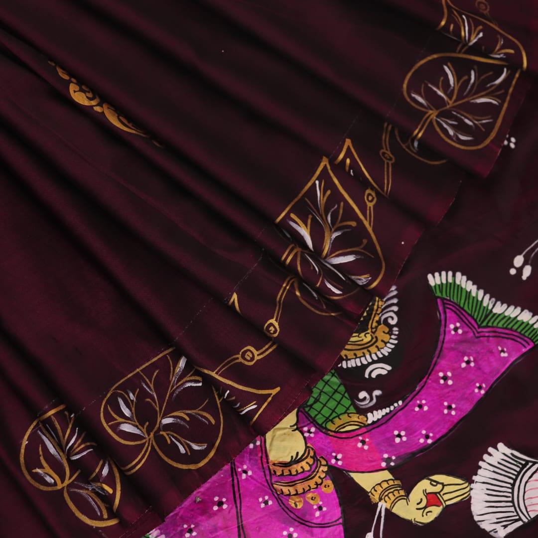 Close-up of a hand-painted silk Patachitra saree, highlighting the vibrant, textured weave and intricate details.