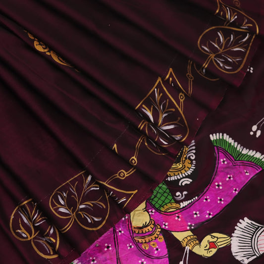 Close-up of a hand-painted silk Patachitra saree, highlighting the vibrant, textured weave and intricate details.