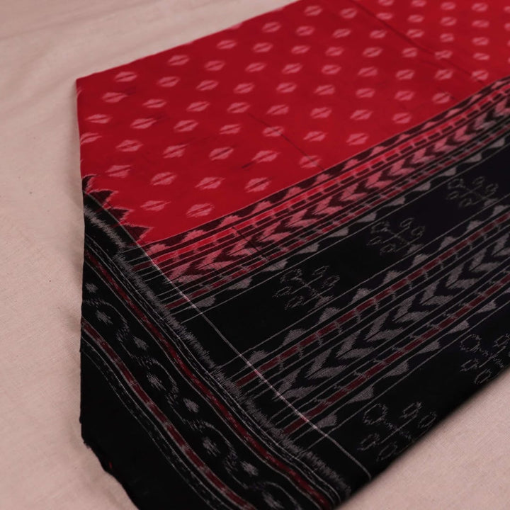 Styling view of a red and black Sambalpuri cotton dupatta with intricate motifs