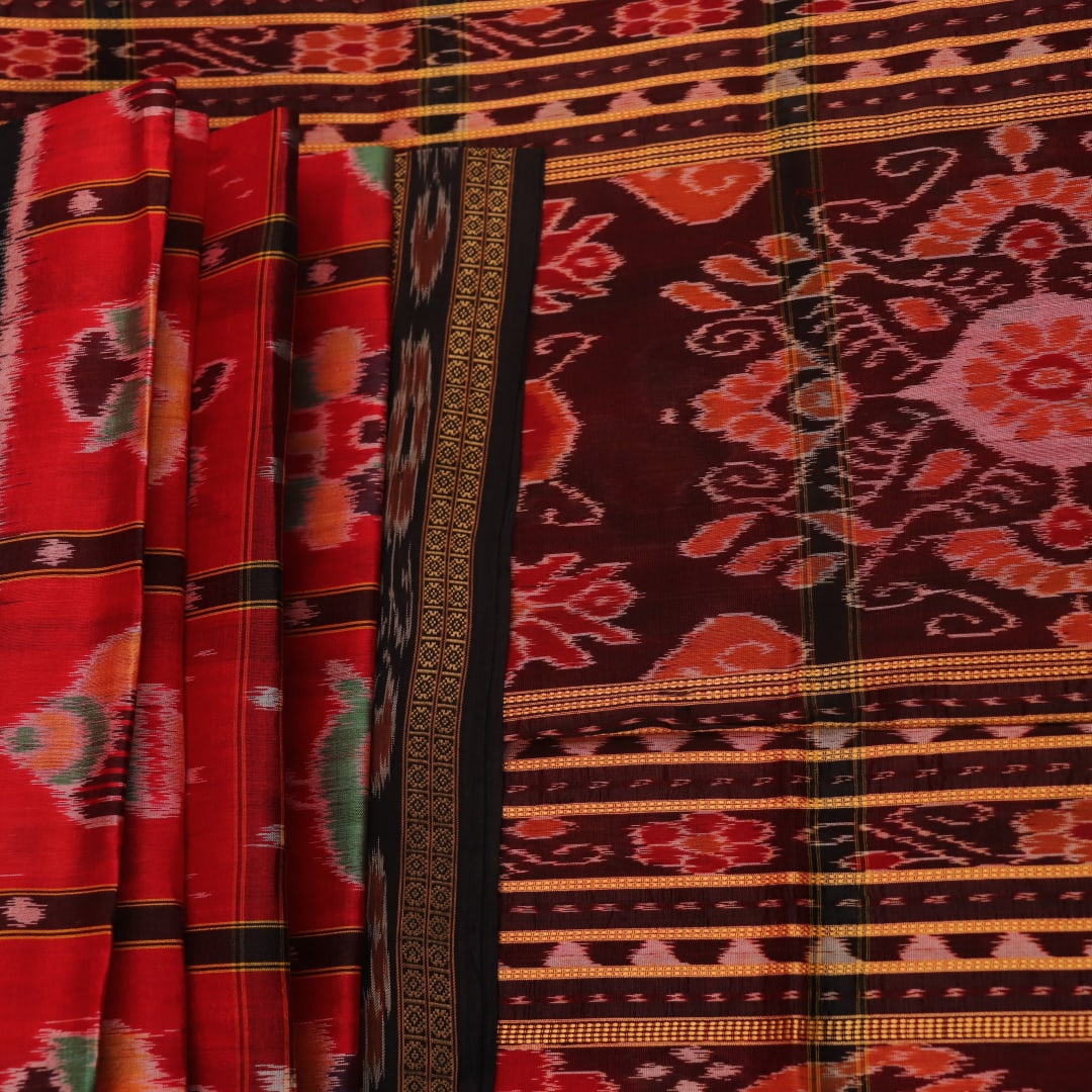 Red and black silk Khandua saree with Nabakothi pattern, styled or draped view showing the overall look.
