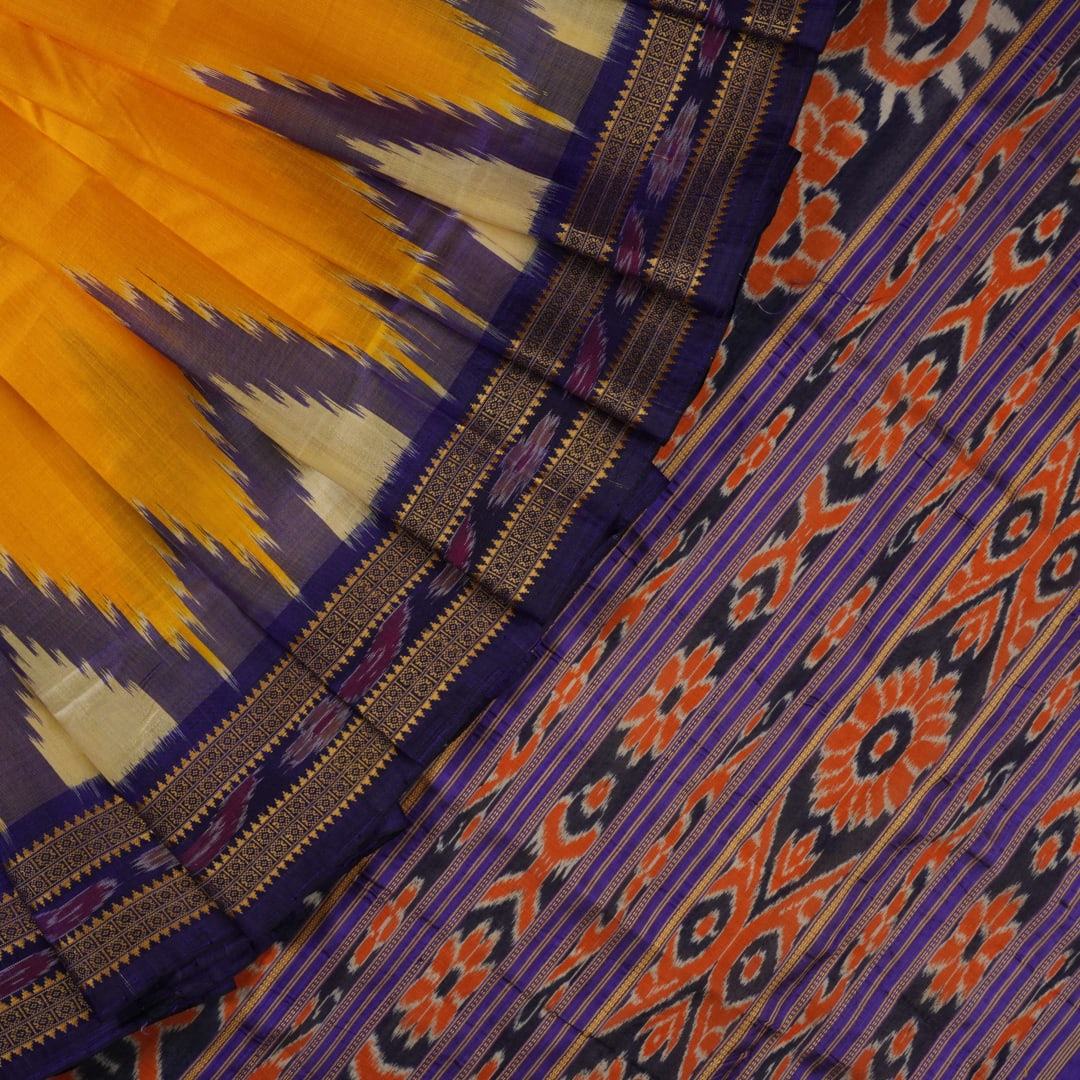 Full styling view of a model draped in a vibrant yellow and blue handloom Khandua silk saree with butta work.