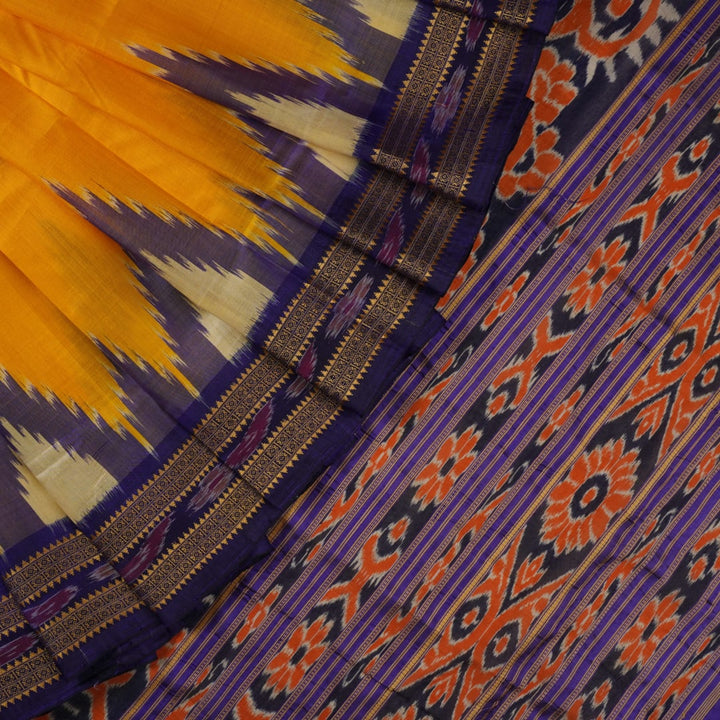 Full styling view of a model draped in a vibrant yellow and blue handloom Khandua silk saree with butta work.