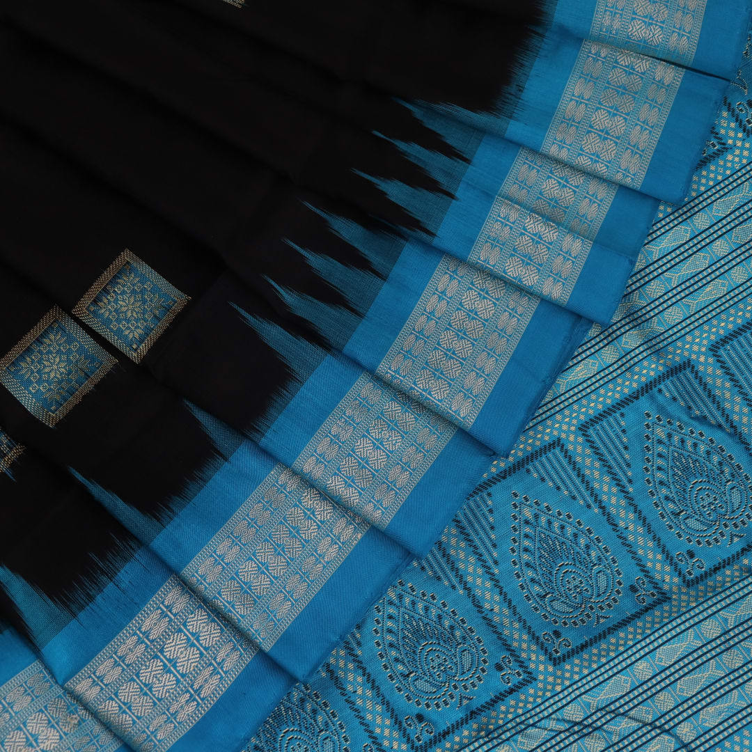 Close-up of Intricate Bomkai Silk Saree Fabric Texture in Black and Blue with Butta Pattern