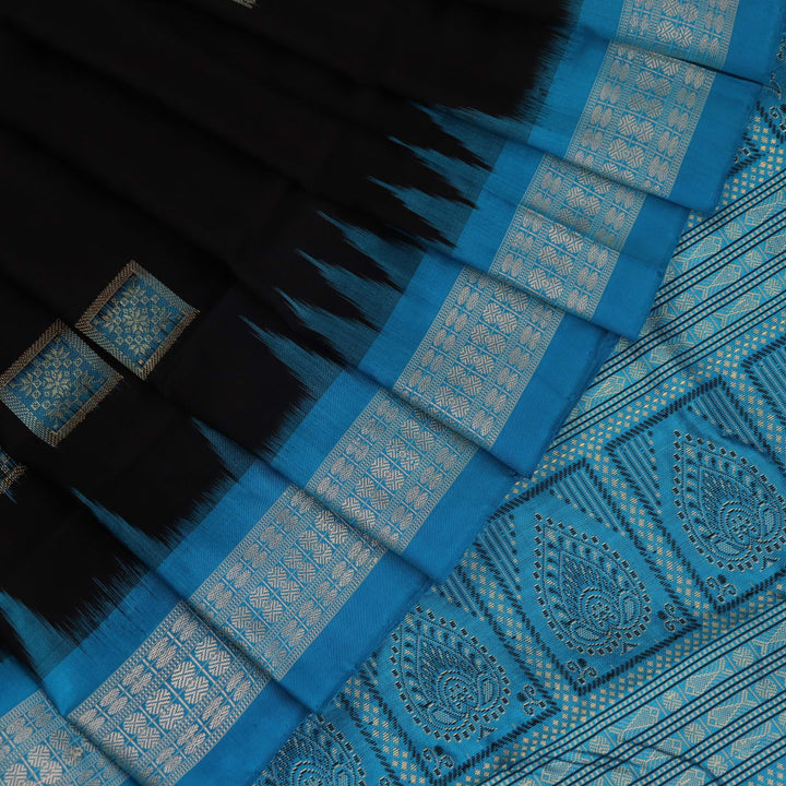 Close-up of Intricate Bomkai Silk Saree Fabric Texture in Black and Blue with Butta Pattern