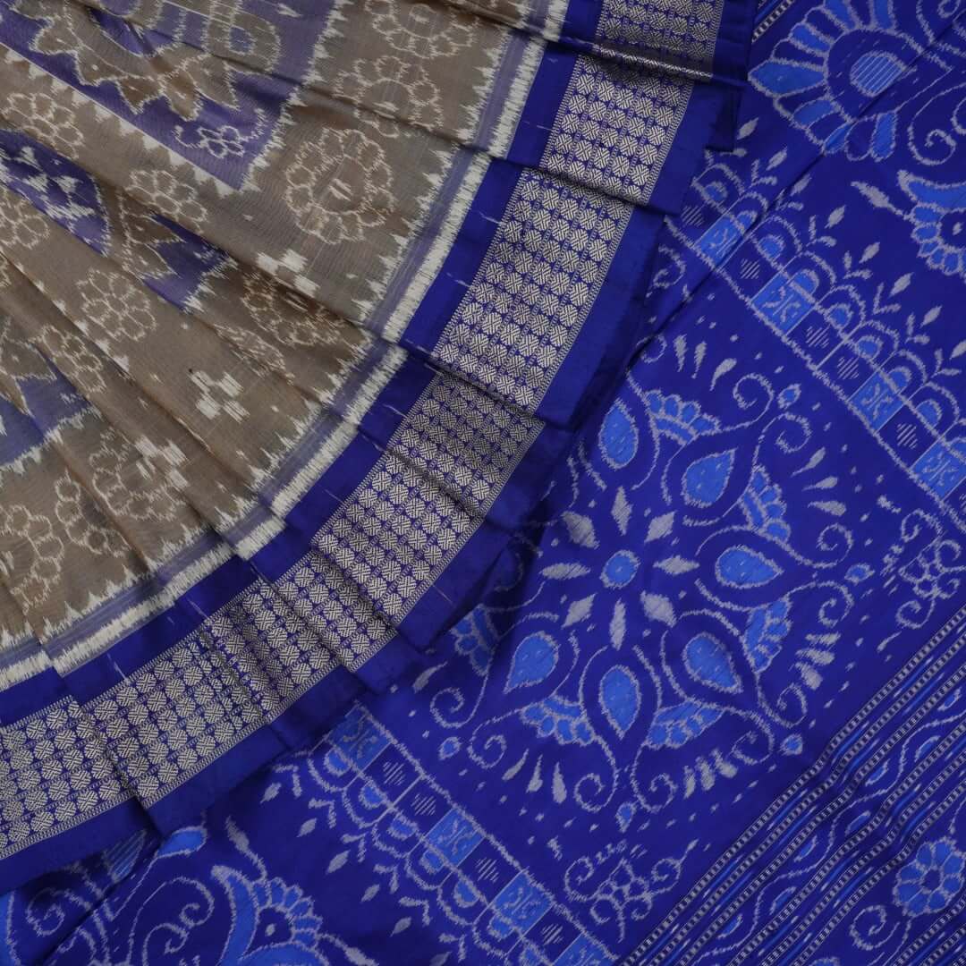 Close-up of the fine texture and handloom weave of the grey and blue Sambalpuri silk fabric