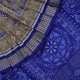 Close-up of the fine texture and handloom weave of the grey and blue Sambalpuri silk fabric