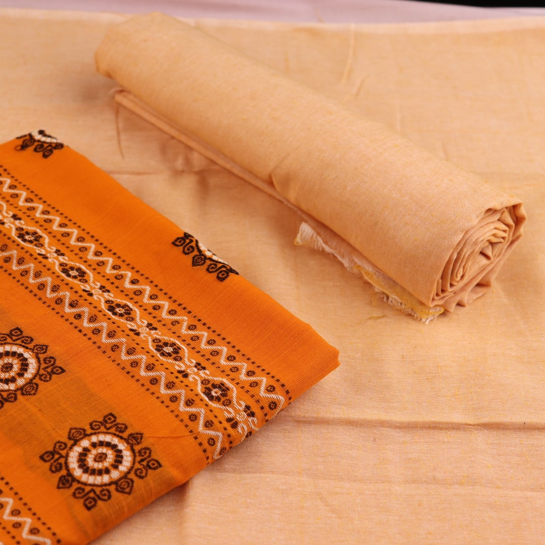 Detail of the coordinating blouse piece for the Bomkai cotton dress material in yellow and cream.