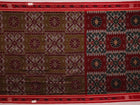 Green and Red Cotton Sambalpuri Saree Draped in a Stylized Manner