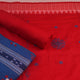 Sambalpuri cotton dress material: Close-up of blue blouse piece with red motifs.