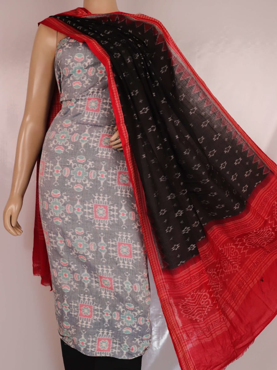 Close-up of blouse piece, showcasing grey cotton with black Sambalpuri motifs