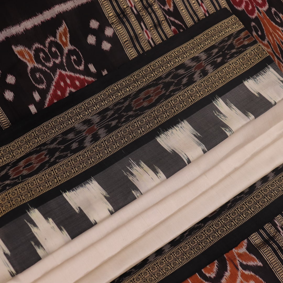 White Khandua silk saree draped, showcasing its plain body and simple elegance.