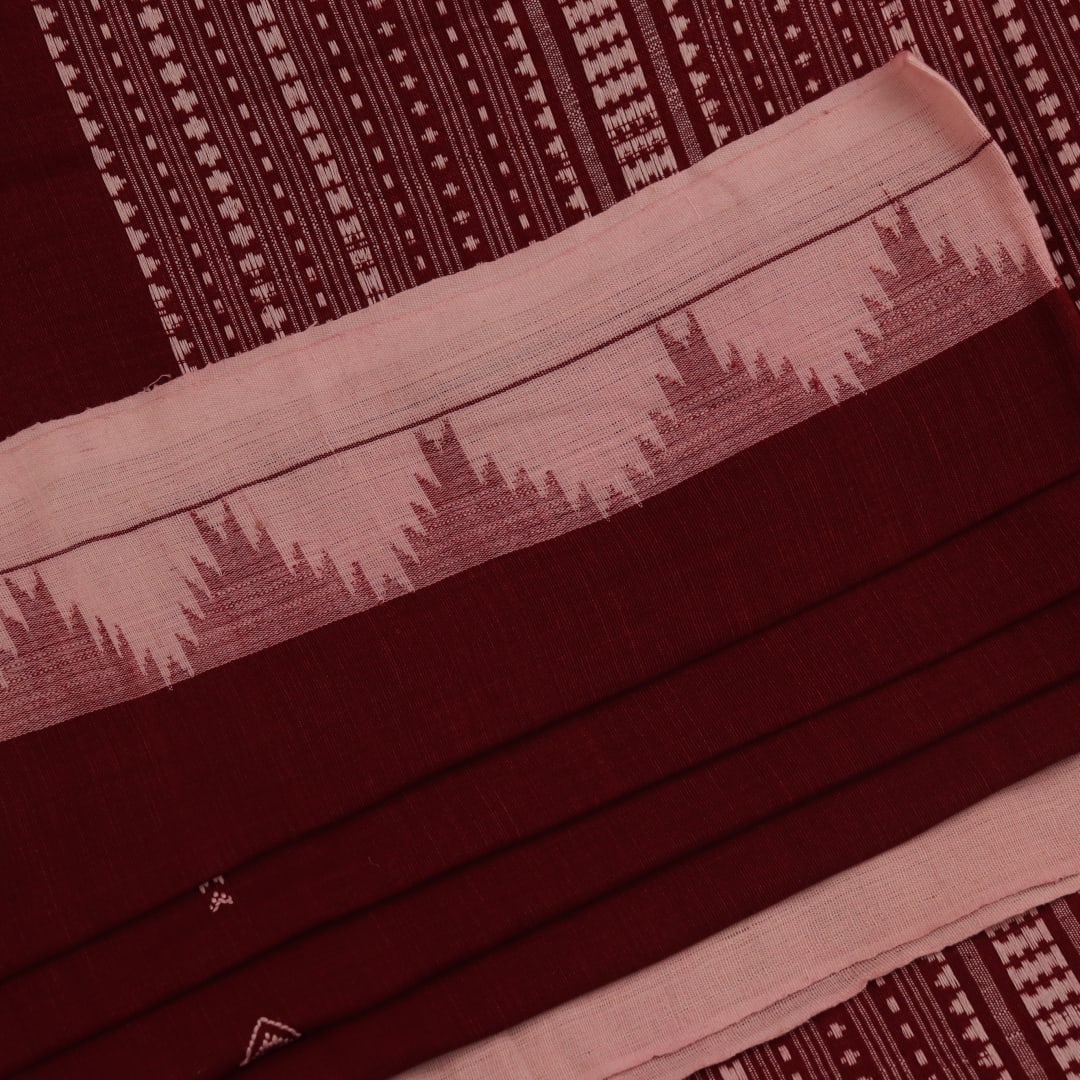 Full view of a maroon and off-white cotton Kotpad saree adorned with a traditional butta pattern.