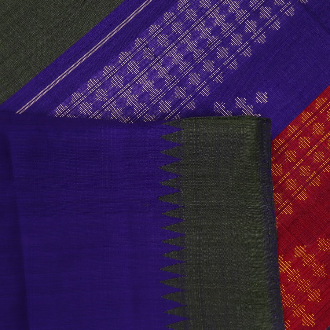 Close-up of the green silk fabric with a butta pattern in the Berhampuri saree