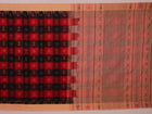 Full product view of a red and cream Sambalpuri cotton saree featuring traditional motifs.