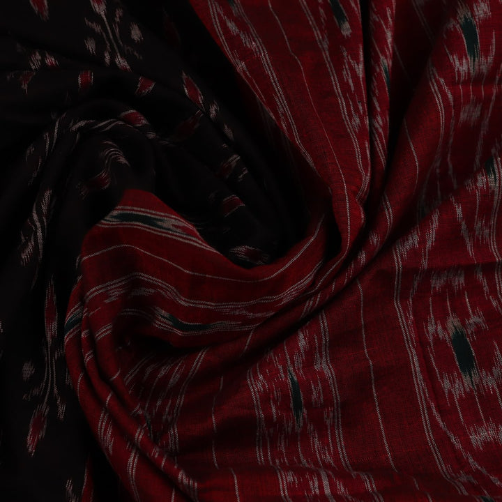 Black cotton Sambalpuri saree with red motifs, draped on a model