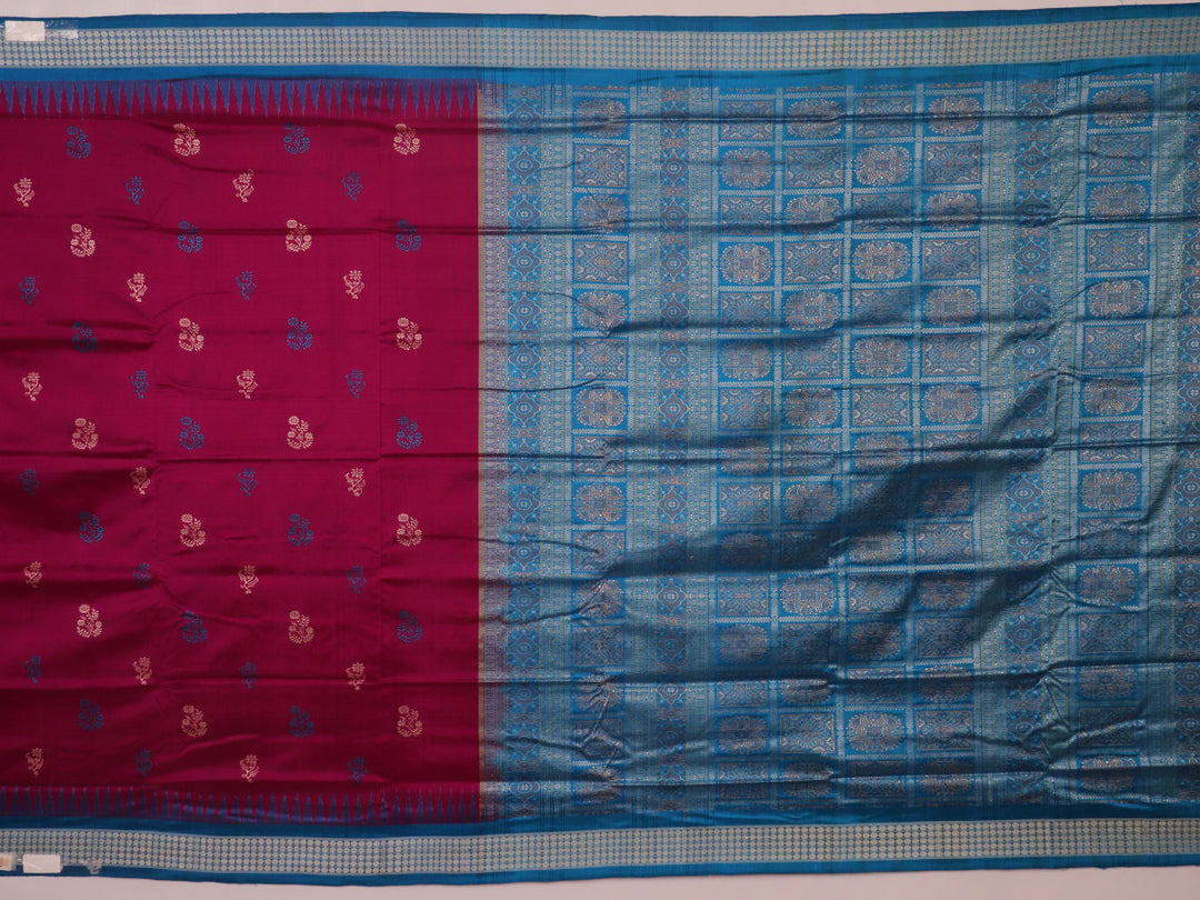 Close-up of Bomkai silk saree's textured weave, featuring magenta, blue, and butta pattern.