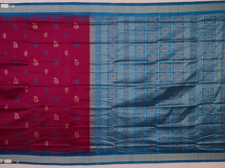 Close-up of Bomkai silk saree's textured weave, featuring magenta, blue, and butta pattern.