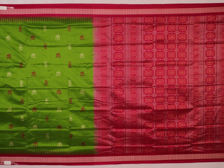 Textured close-up of green Bomkai silk saree fabric, revealing intricate weave and magenta butta pattern.
