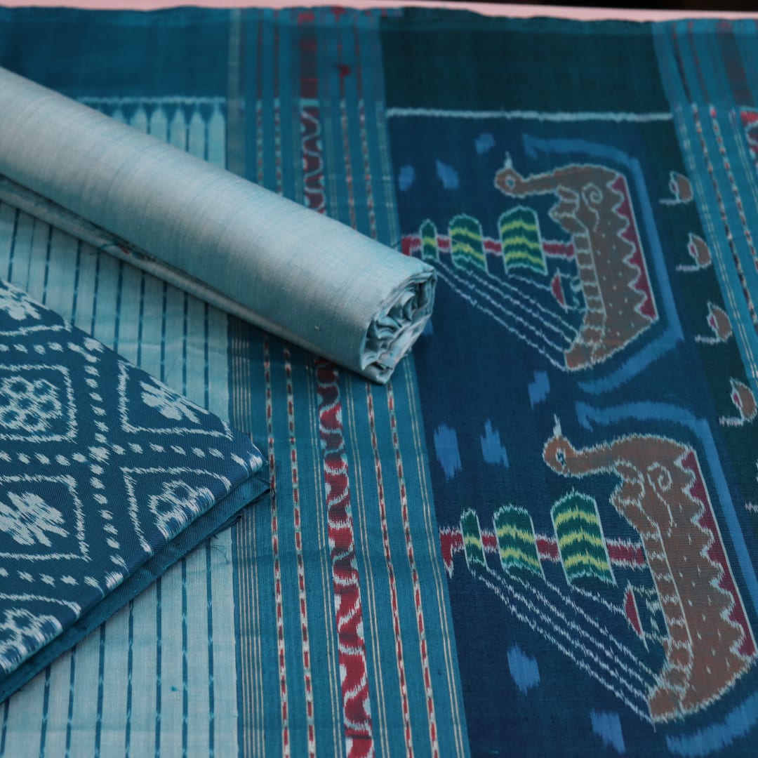 Detail of blue Sambalpuri silk dress material blouse piece with motifs.