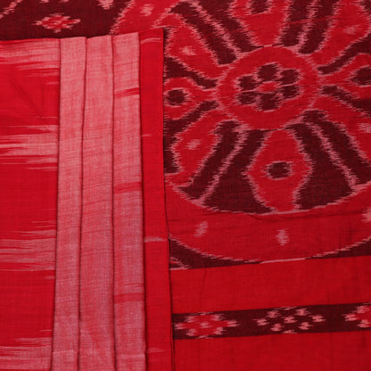 Pink and red Sambalpuri cotton saree draped; showcases overall look and styling with motifs visible.