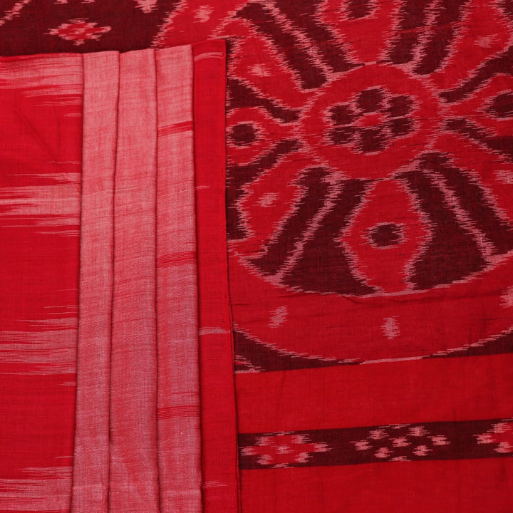 Pink and red Sambalpuri cotton saree draped; showcases overall look and styling with motifs visible.