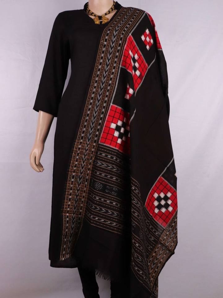 Red and black Sambalpuri cotton dupatta styled draped elegantly