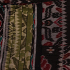 Green cotton Sambalpuri saree in styling view, showcasing motifs and draping style.