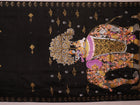Close-up of black silk Patachitra saree fabric, showcasing hand-painted texture and detail.