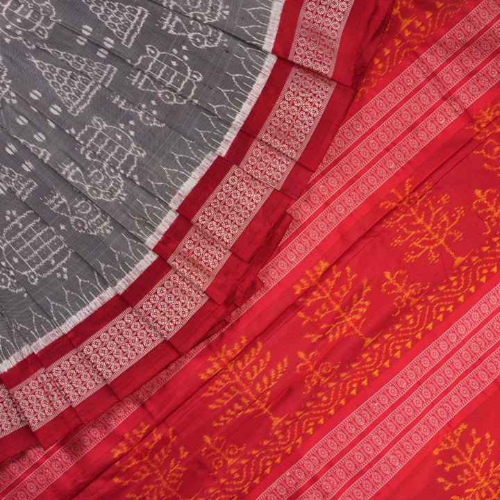 Close-up of the soft, lustrous grey Sambalpuri silk fabric texture, highlighting the intricate weave and motifs.