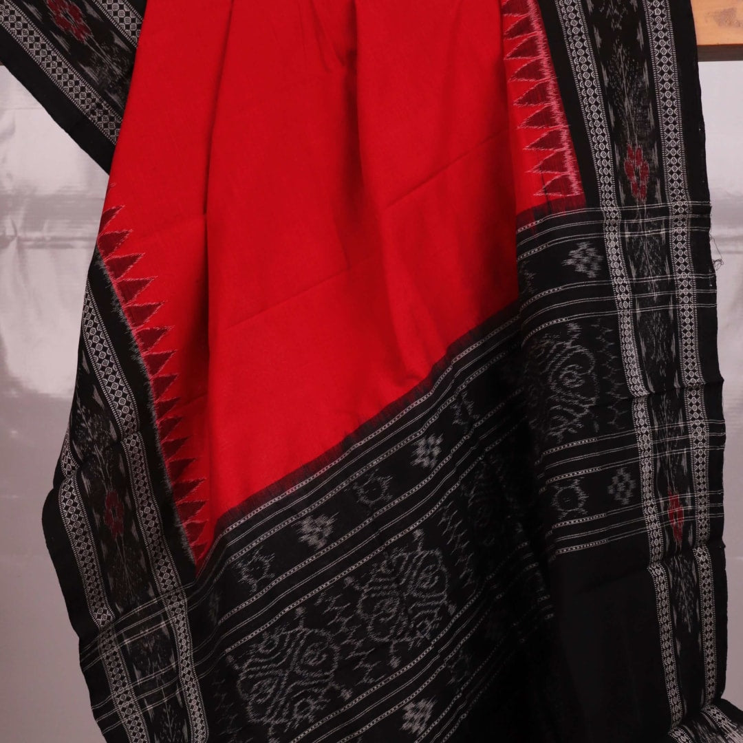 Sambalpuri Cotton Dupatta in Red and Black, with a plain pattern, draped for styling.