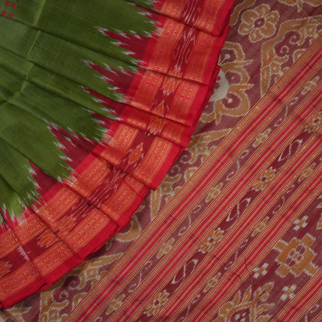 Model draped in a green and red Khandua silk saree with traditional butta work and rich border.