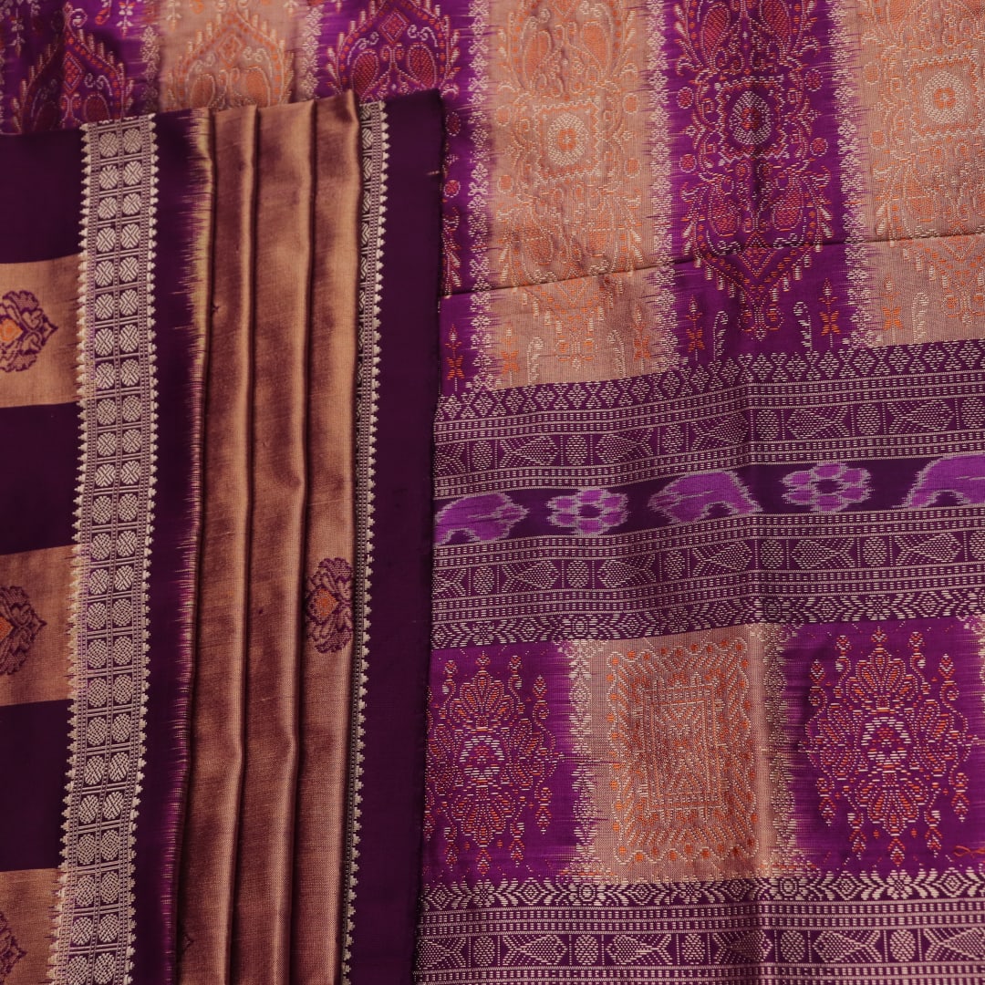 Close-up of the smooth, lustrous texture of multi-color and violet Bomkai silk saree, featuring butta weave.