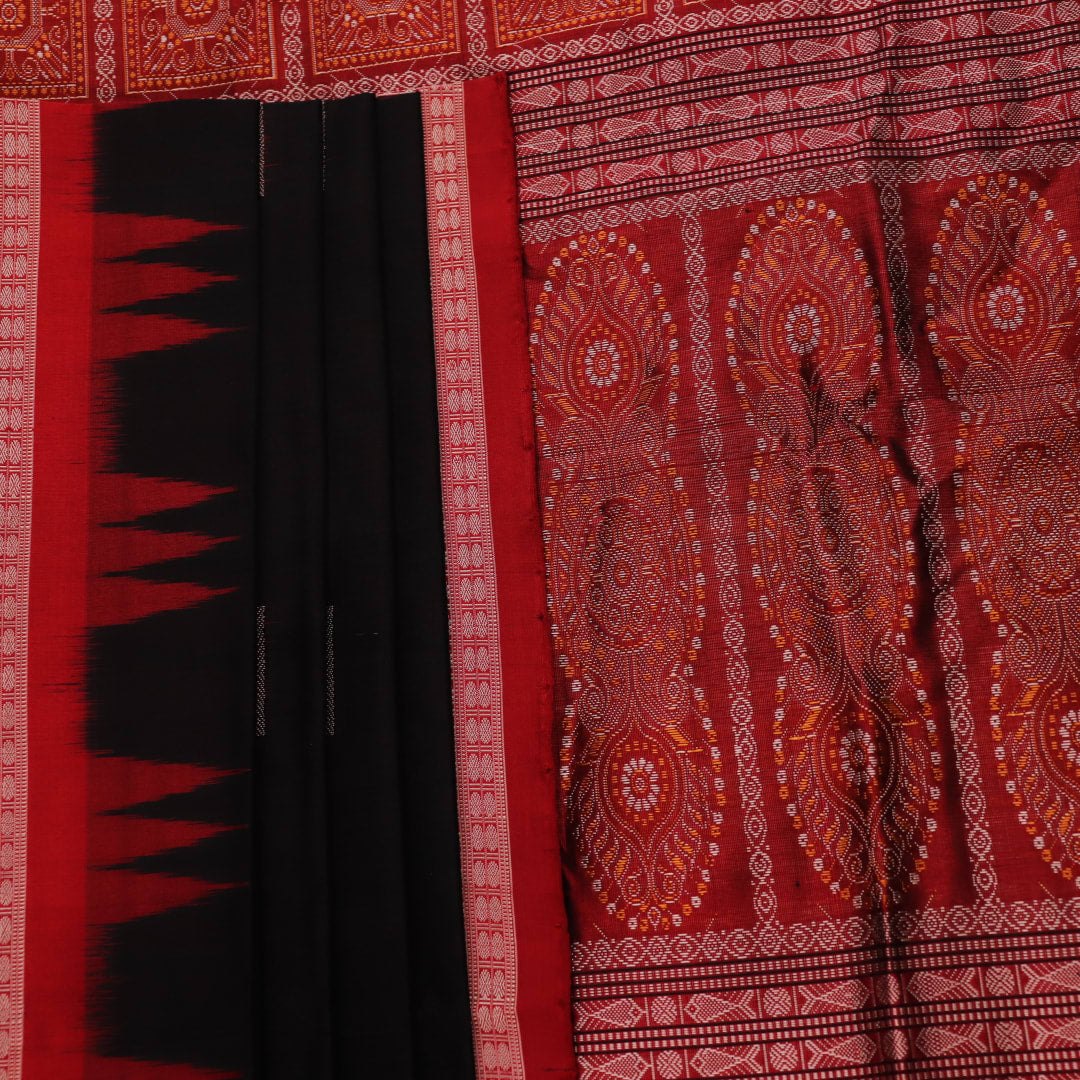 Close-up of black and red silk Sambalpuri saree fabric showcasing intricate motifs