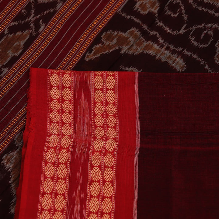 Full view of a maroon cotton Bomkai saree featuring a butta pattern with a red border and pallu.