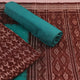 Close-up of the brown and green Sambalpuri cotton dress material's blouse piece with motifs.