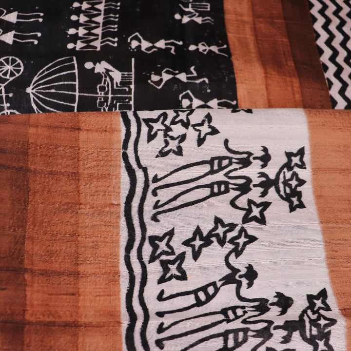 Full view of a green and brown Tussar silk saree featuring traditional motifs throughout the body.