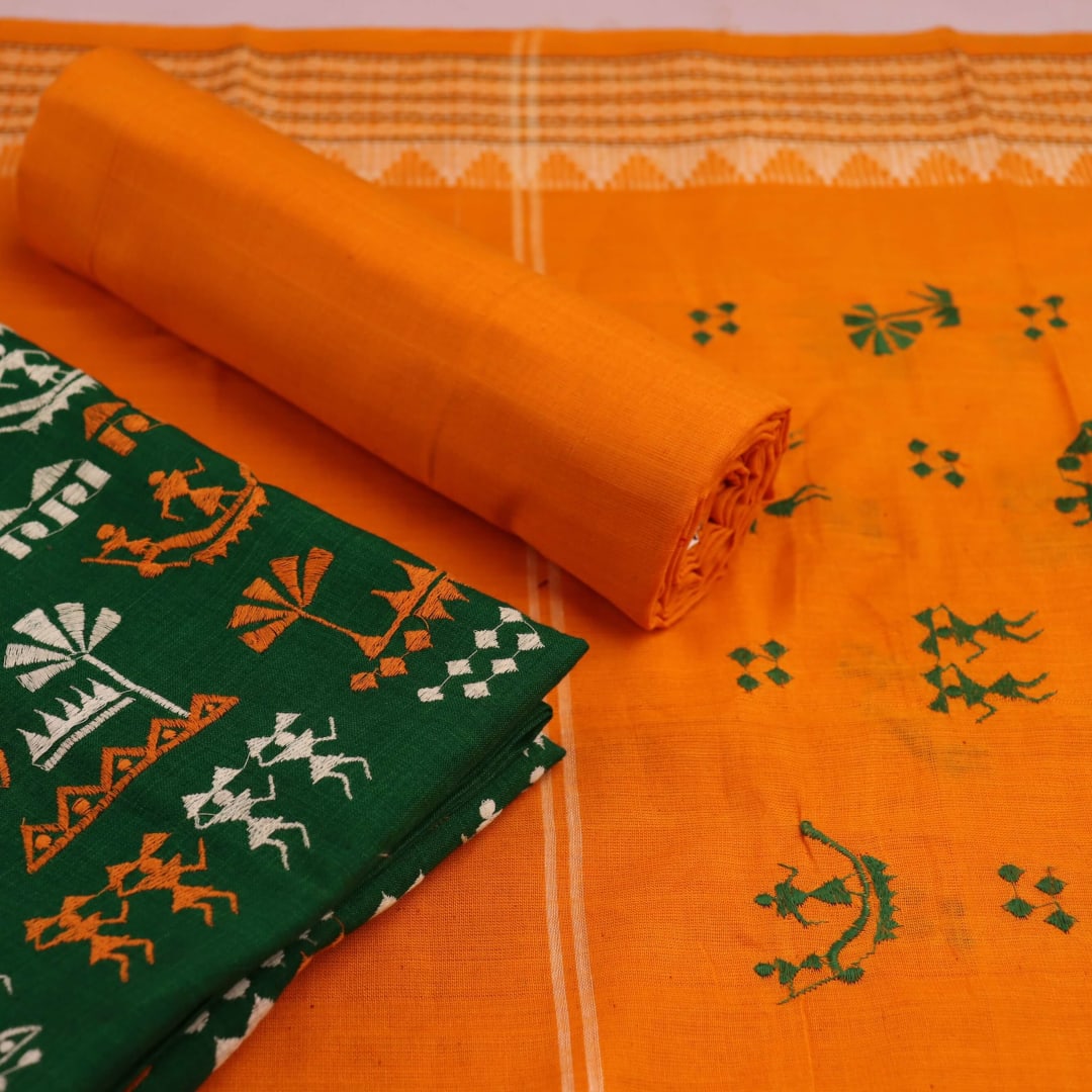 Close-up of green Sambalpuri handloom dress material with a yellow doll pattern