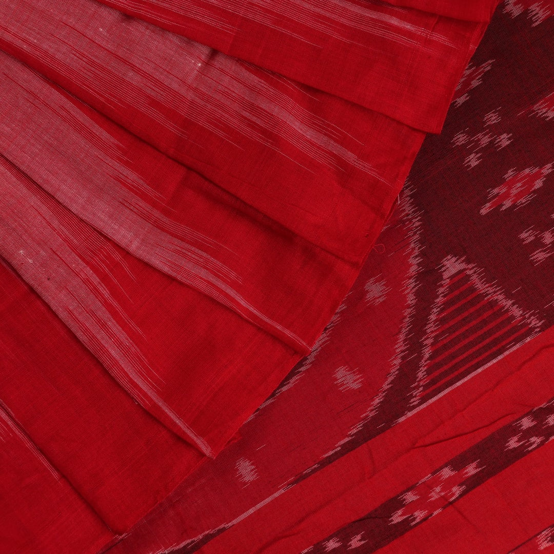 Pink and red Sambalpuri cotton saree draped; showcases overall look and styling with motifs visible.