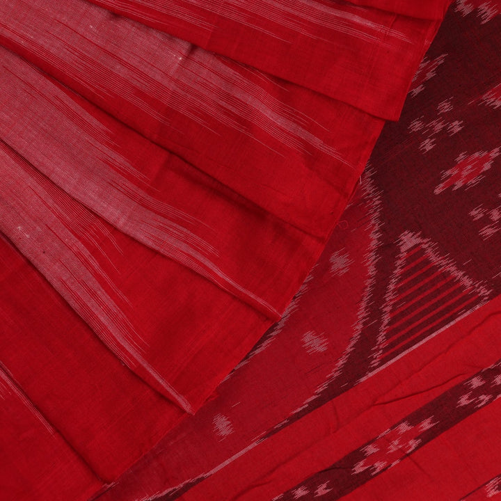 Pink and red Sambalpuri cotton saree draped; showcases overall look and styling with motifs visible.