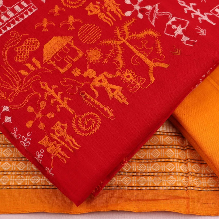 Close-up view of the yellow blouse piece with red doll patterns in Sambalpuri style cotton dress material