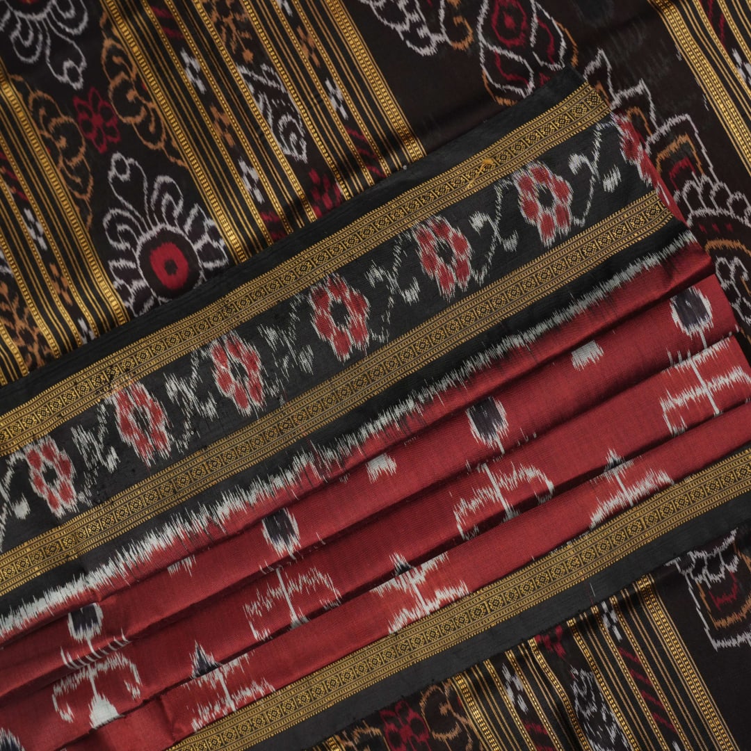 Full styling view of an elegant brown and black Khandua silk saree draped on a model for a classic look.