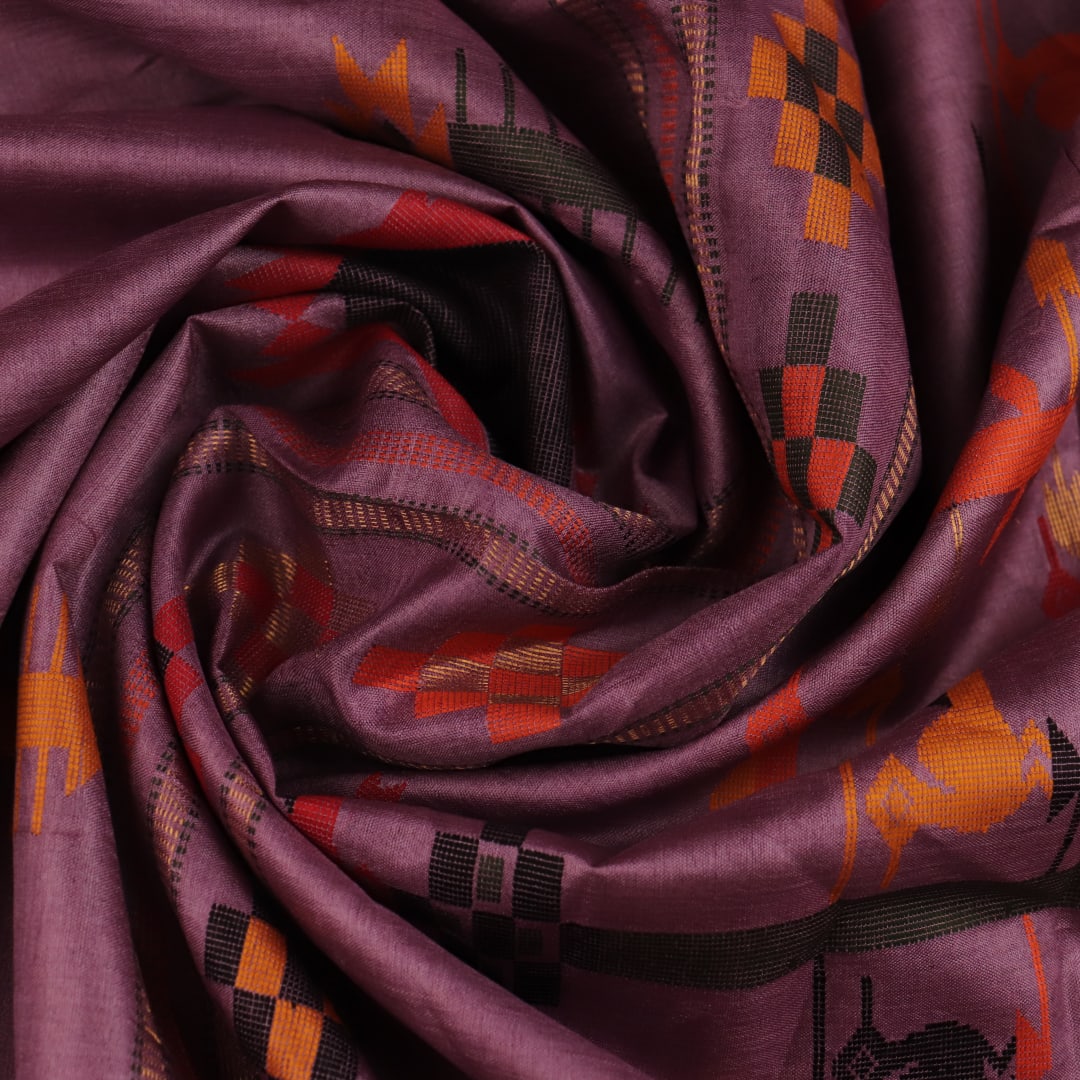 Close-up view of the textured Tussar silk fabric of the saree