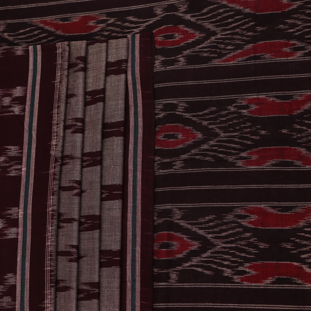 Elegantly draped grey Sambalpuri cotton saree with maroon motifs.