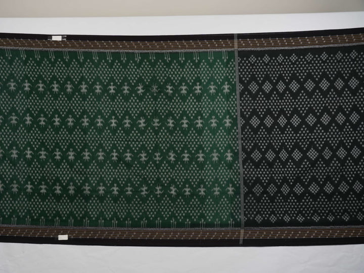 Elegant model draping a green and black Sambalpuri cotton saree with traditional Odisha handloom motifs.